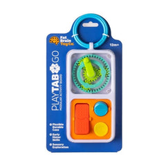 Fat Brain Toy Box PlayTab Go modular activity board in its retail packaging, featuring a green gear and handle, an orange rectangular piece, and blue and yellow circular pieces.