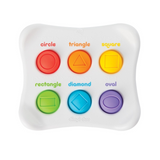 Colorful shape recognition toy with labeled buttons on a white background