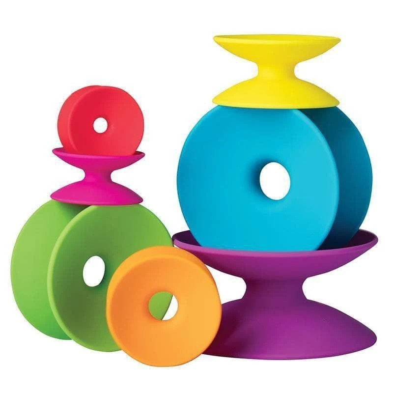A set of colorful ring shapes on a plain white background. The set includes blue, green, orange, pink, and yellow pieces arranged together.