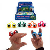 A retail display box of plastic finger spies shown above four loose finger spies in yellow, green, orange, and pink, with two hands demonstrating how to wear and use the red and blue finger spies.