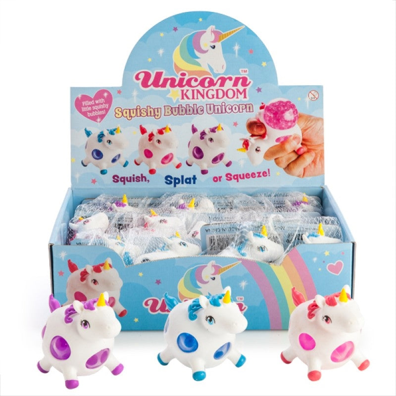 Display box of Unicorn Kingdom squishy bubble unicorn toys with packaging and toys in front.