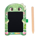 A green dinosaur-themed children's drawing tablet with cartoon eyes, paws, and a wooden stylus on a plain white background. The bottom of the tablet reads 'DOODLE PALS'.