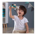 Child playing with a wooden Retro Plane With Cute Dog Driver